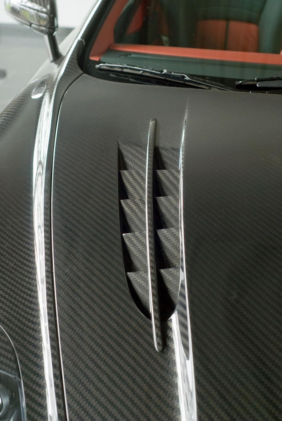 Детали экстерьера Aston Martin DB9 Cyrus by Mansory 2009 года  (фото 17 из 34)